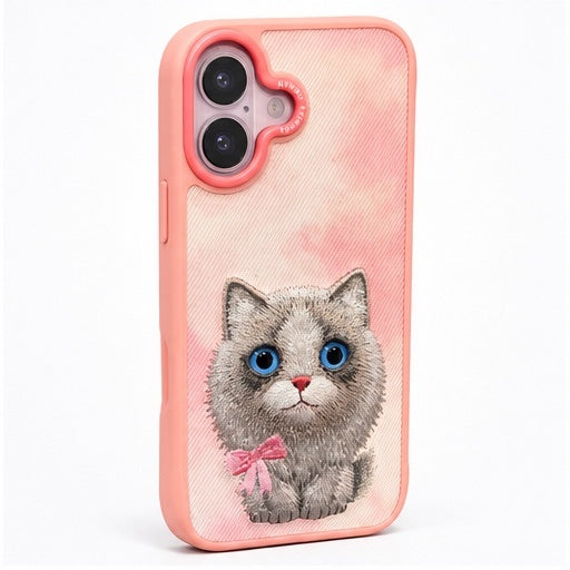 Angled view showing pink case edges and embroidered kitten
