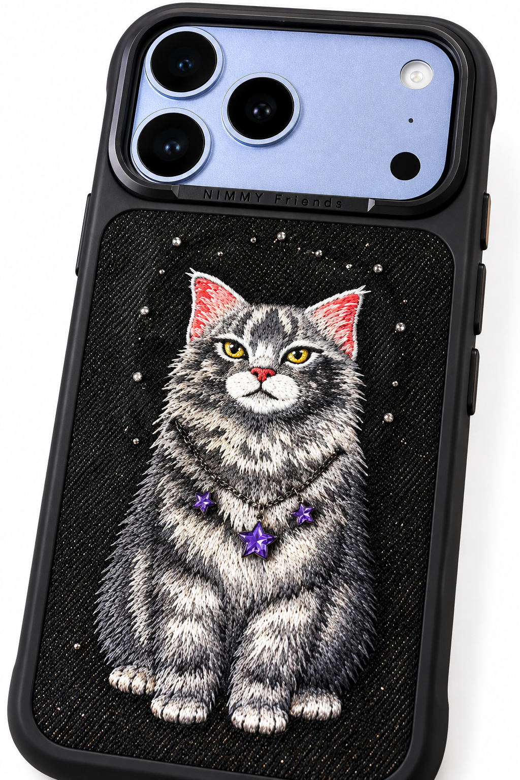 Close-up detail of black embroidered kitten phone case, stitching, glitter texture and purple star embellishments