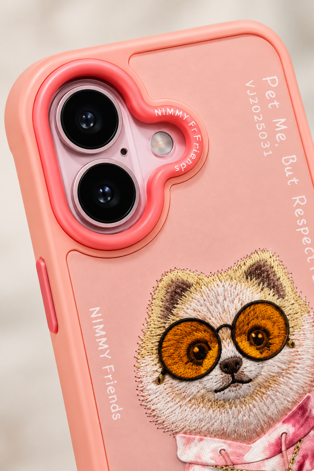 Raised camera surround and lens openings on Nimmy Friends pink phone case